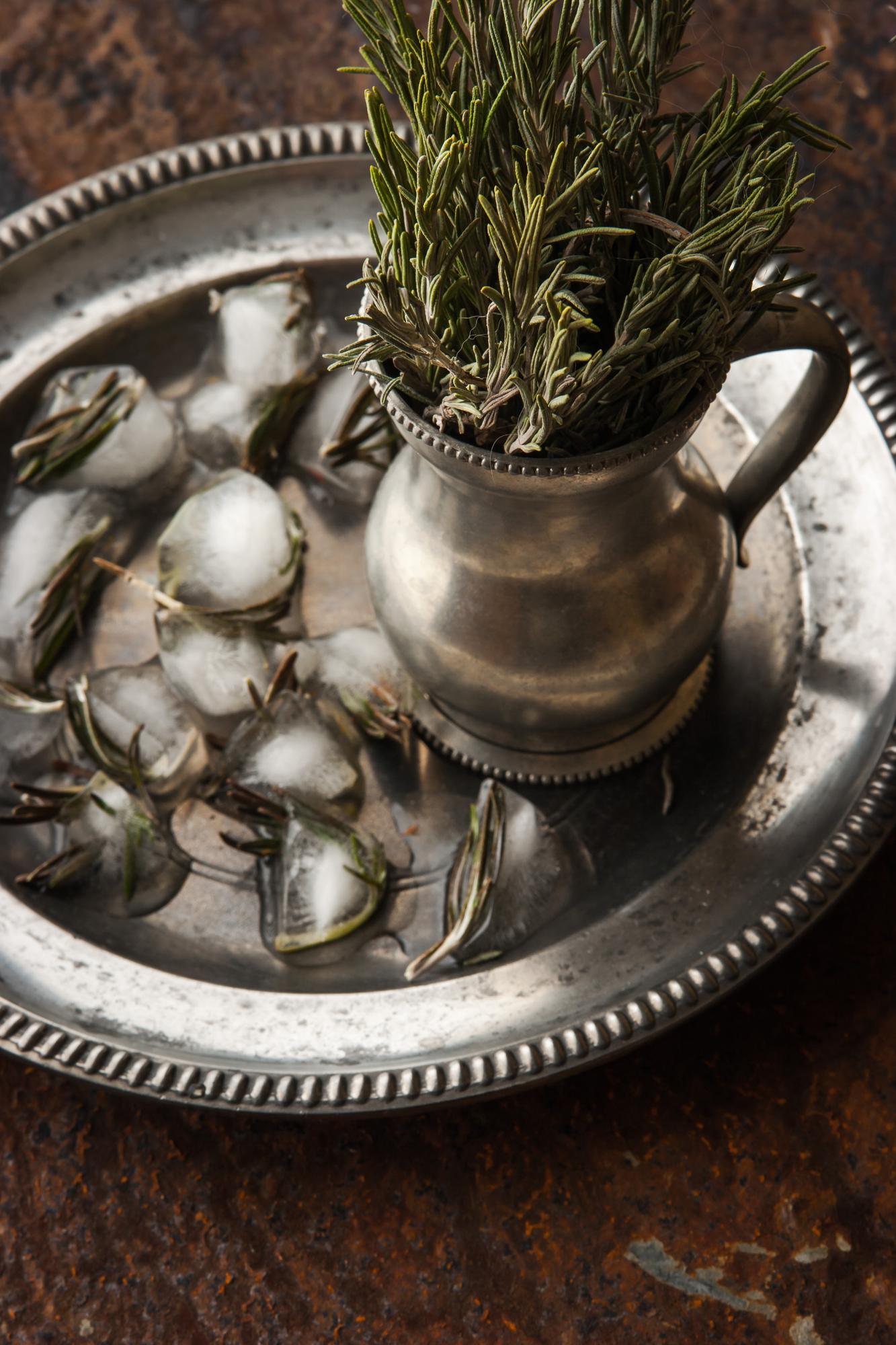 close-up of vintage copper pans and herbs